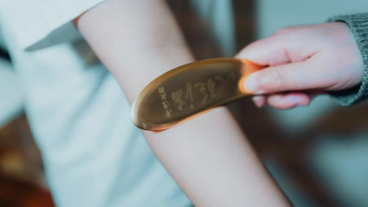 Professional gua sha treatment using Tiger Talisman Copper Bian in Greater Vancouver
